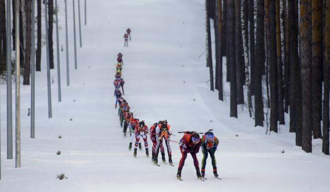 Skiers compete during the Biathlon men's World Cup 15km mass start event, in Tyumen, Russia, Sunday, March 25, 2018. (AP Photo/Sergei Grits)