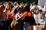 CHARLY TRIBALLEAU / AFP Students react after checking the results of the French general baccalaureat exam (high school graduation) at the lycee Malherbe in Caen, northwestern France, on July 6, 2018. / AFP / CHARLY TRIBALLEAU
