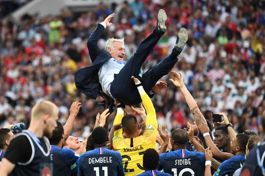  Didier Deschamps carried in triumph by his players. 