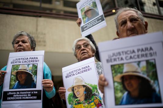  Protesters denounce the killing of Honduran environmental activist Berta Caceres, in front of the Honduran Embbady in Santiago, Chile, on March 7, 2016. 