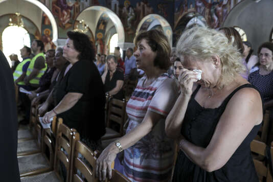  On July 29, burials succeed in the Orthodox Church of the Greek village of Mati, after the fires that killed at least 91 people. 