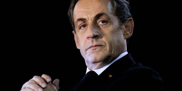 (FILES) In this file photograph taken on November 24, 2014, former French president Nicolas Sarkozy looks on during his rally as candidate for the presidency of the French right-wing main opposition party UMP in Andard, near Angers, western France.  The Paris Court of Appeal is set to examine on May 16, 2018, the appeal of former President Nicolas Sarkozy against his referral to the Criminal Court in the case of excessive spending of his 2012 presidential campaign and the false invoices of society. / AFP / JEAN-SEBASTIEN EVRARD
