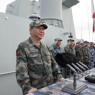 (180412) -- SANYA, April 12, 2018 (Xinhua) -- Chinese President Xi Jinping, also general secretary of the Communist Party of China Central Committee and chairman of the Central Military Commission, reviews the Chinese People's Liberation Army (PLA) Navy in the South China Sea on April 12, 2018. Xi made a speech after the review. (Xinhua/Li Gang) (zkr)