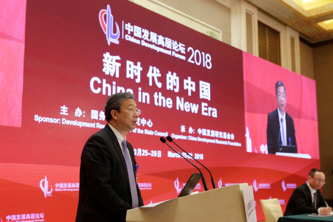 Yi Gang, gouverneur de la Banque centrale de Chine, à Pékin, le 25 mars. La Chine a contribué pour un tiers à la flambée mondiale de la dette.
