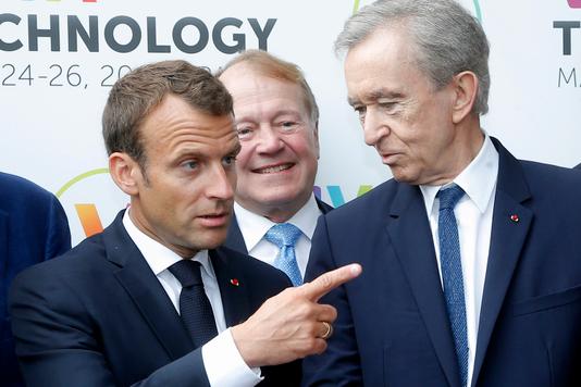 MICHEL EULER / AFP President Emmanuel Macron meets Bernard Arnault, president of the LVMH group, on 24 May in Paris.