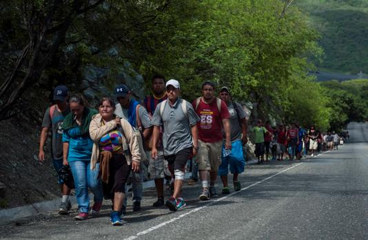 Oliver de Ros / AP Migrants from Honduras to the United States arrive in Zacapa, Guatemala, on October 24.