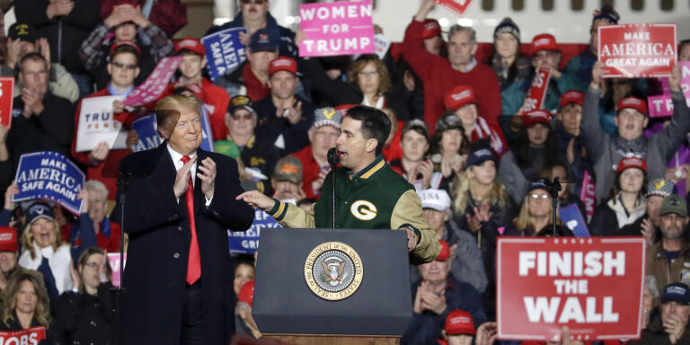 With President Donald Trump at his side Wisconsin Gov. Scott Walker speaks during a rally Wednesday, Oct. 24, 2018, in Mosinee, Wis. (AP Photo/Mike Roemer)