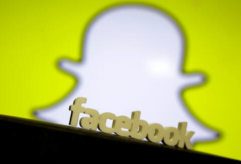 A 3D printed Facebook logo is seen in front of a displayed Snapchat logo in this picture illustration taken August 11, 2017. REUTERS/Dado Ruvic/Illustration - RC1E9A700140