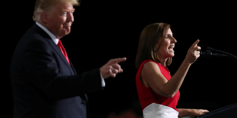 U.S. President Donald Trump and Senate candidate Martha McSally rally with supporters at Phoenix-Mesa Gateway Airport in Mesa, Arizona, U.S. October 19, 2018. REUTERS/Jonathan Ernst