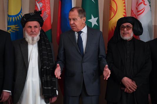YURI KADOBNOV / AFP Russian Foreign Minister Sergei Lavrov, surrounded by emissaries from the Kabul regime and the Taliban, in Moscow on 9 November.