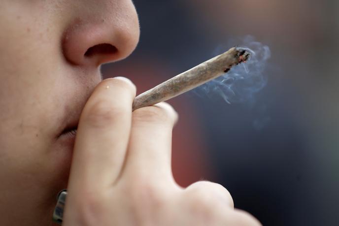 One man smells cannabis in a demonstration for legalization advantage, May 2 in Paris.
