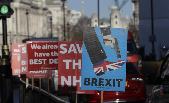 Banners are tied to railings on the roadside near parliament in London, Tuesday, January 22, 2019.