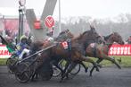 Jean Michel Bazire of France, foreground, crosses the finish line with his horse Belina Josselyn to win the Grand Prix d'Amerique trotting race at the Vincennes racetrack, outside Paris, Sunday, Jan. 27, 2019. (AP Photo/Michel Euler)