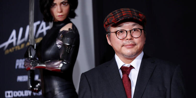 Novel creator Yukito Kishiro poses at the premiere for the movie 