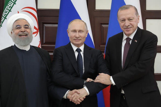 Le président iranien, Hassan Rohani, le président russe, Vladimir Poutine, et le président turc, Recep Tayyip Erdogan, à Sotchi (Russie), le 14 février.