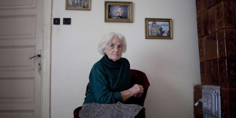 Mandatory Credit: Photo by Odeta Catana / Rex Features (2153994a)
Elena Maria Vlad, 88, worked most of her life as a primary school teacher in Calarasi. She has never thought of leaving her house or living abroad. (Calarasi, Romania)
Romania's Forgotten Generation
Romania's Forgotten Generation

When border controls are relaxed in 2014 an influx of Romanians with plans to move to the UK permanently is expected, but what will happen to the families that are left behind? 

Mature student Odeta Catana, 30, investigates the effects of migration on three generations of Romanian women through this photo series, Mother Romania. 

Odeta, who is currently living in Wales, left her hometown Calarasi in Romania two years ago and believes she speaks for her community and majority of her country when she says, 'a major social issue has emerged, families are being split up as parents emigrate in search of work, meanwhile their children and elderly relatives are being left behind'. 

Depicting the state of the nation through photographs, Odeta has taken pictures of the future generation of Romania, six teenage girls left at home while their families work in foreign countries; the present-day generation of middle-aged woman who all work abroad and images of Romania's past, elderly woman who stay in the country, usually to look after their grandchildren. 

Highlights include 16-year-old Silva Radu who is one of ten children and in order to raise them her father has had to move to Italy for work. 

All of the middle-aged women pictured either work or study abroad including Mihaela Istrate, 33, who has been living and working in Madrid for the past few years in the hotel industry and Laura Valentina Grigore, 28, has been working in the UK for three years, at present she is a childminder. 

The elderly women who Odeta has photographed have never thought of leaving the country but have childre...
For more information visit http://www.rexfeatures.com/stacklink/CFRSDYTZA/Rex_ROMANIA_S_FO