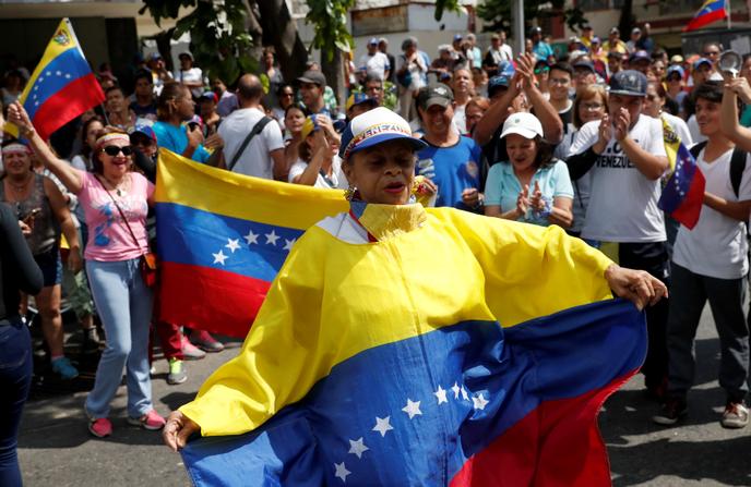 Les partisans de l’opposition prennent part à un rassemblement contre le gouvernement du président vénézuélien Nicolas Maduro, à Caracas.