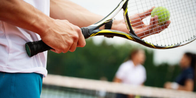 Happy fit people playing tennis together. Sport concept