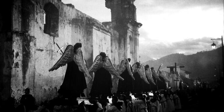 A parade of Angels passes by the former convent of Concepción during the Procession of Holy Mary of the Solitude on Holy Saturday. Antigua, Sacatepequez, Guatemala. April 19, 2014.