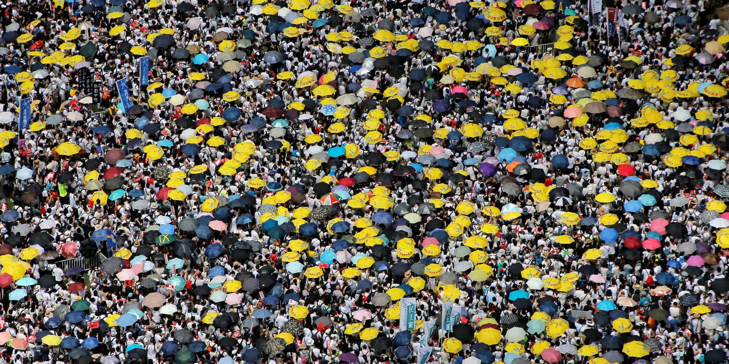 THOMAS PETER / REUTERS Demonstrators hold yellow umbrellas, the symbol of the Occupy Central movement, during a protest to demand authorities scrap a proposed extradition bill with China, in Hong Kong, China June 9, 2019. REUTERS/Thomas Peter