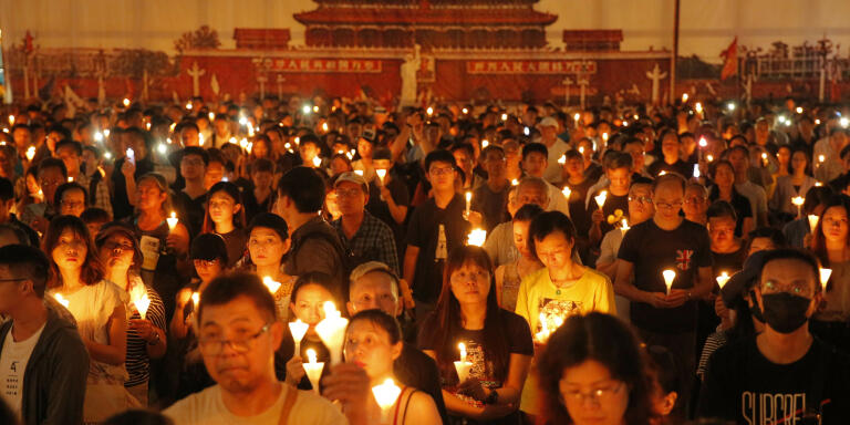 Thousands of people attend a candlelight vigil for victims of the Chinese government's brutal military crackdown three decades ago on protesters in Beijing's Tiananmen Square at Victoria Park in Hong Kong, Tuesday, June 4, 2019. Hong Kong is the only region under Beijing's jurisdiction that holds significant public commemorations of the 1989 crackdown and memorials for its victims. Hong Kong has a degree of freedom not seen on the mainland as a legacy of British rule that ended in 1997. (AP Photo/Kin Cheung)