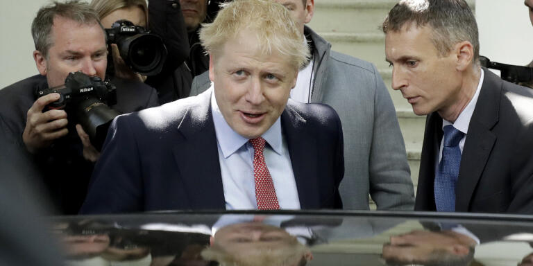 British Conservative Party leadership and prime minister contender Boris Johnson gets in a car as he leaves home in south London, Friday, June 21, 2019. Britain's next leader will be chosen by about 160,000 members of the governing Conservative Party in a runoff between two candidates: former Foreign Secretary Boris Johnson and current Foreign Secretary Jeremy Hunt. (AP Photo/Matt Dunham)