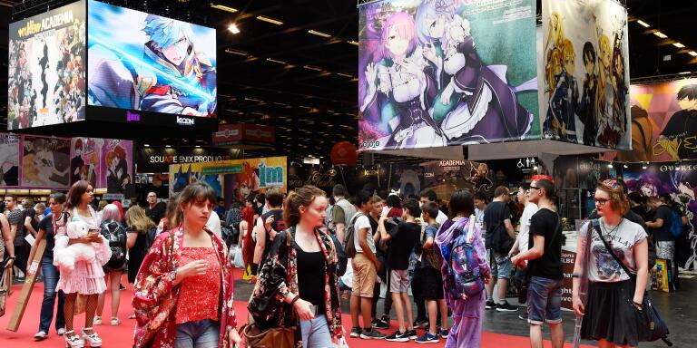 (FILES) In this file photo taken on July 6, 2017, people visit the 2017 Japan Expo exhibition in Villepinte, near Paris.  Japan Expo, the largest European festival dedicated to Japanese culture and leisure, opens on July 4 near Paris with the exceptional presence of Gô Nagai and Leiji Matsumoto, the creators of the giant robot Goldorak and space pirate Albator. / AFP / BERTRAND GUAY

