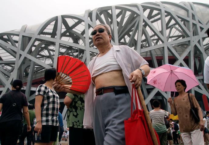 A man with a t-shirt raised the fate of the national stadium, Beijing, China, august 2009.