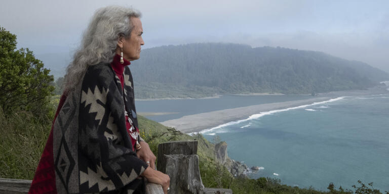 Judge Abby Abinanti looks over at the mouth of the Klamath River. The river is a fundamental part of Yurok tradition and culture.

Abinanti, who became the first Native American woman admitted to the State Bar of California in 1974, created the Wellness Court, a part of the tribal court, which offers a healing path for nonviolent offenders struggling with substance abuse. In 2018, a Family Wellness Court was also created for parents who are struggling to care for their children as a result of substance abuse.
“This court is very different from others in its approach,” Abinanti said. “There’s not just one way to do things. Our practices are derived from our traditional value systems, our village values, which involve the community.