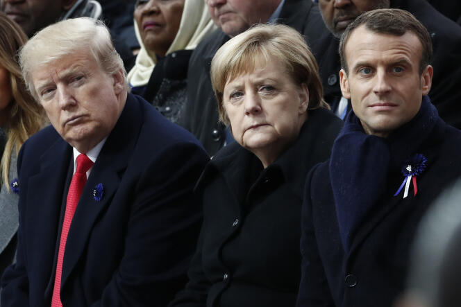 Emmanuel Macron, Angela Merkel et  Donald Trump, lors de la cérémonie commémorant les 100 ans de l’ armistice, devant l’Arc de Triomphe, à Paris, le 11 novembre 2018.