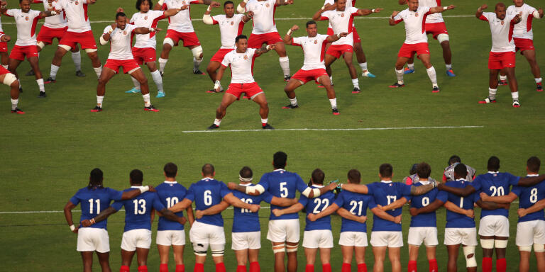 Rugby Union - Rugby World Cup 2019 - Pool C - France v Tonga - Kumamoto Stadium, Kumamoto, Japan - October 6, 2019 Tonga players perform the Sipi Tau dance in front of France players before the match REUTERS/Peter Cziborra