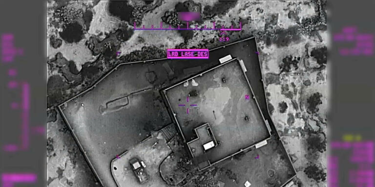 This image from video released by the Department of Defense on Wednesday, Oct. 30, 2019, and displayed at a Pentagon briefing, shows an image from a remotely piloted aircraft shows the compound of Islamic State leader Abu Bakr al-Baghdadi after the raid and moments before it was destroyed on Saturday, Oct. 26, 2019. (Department of Defense via AP)