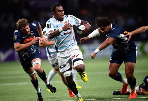 (FILES) In this file photo taken on September 08, 2018 Racing 92 Fijian flanker Leone Nakarawa (C) vies with Agen's Tongan flanker Opeti Fonua (R) during the French Top 14 rugby union match between Racing 92 and Agen at the U Arena in Nanterre, near Paris. French Top 14 rugby union team Racing 92 announced on December 6, 2019 that it broke its contract with the Fijian international player Leone Nakarawa, one of the top-14 figures and voted Europe's best player in 2018, due to his delayed return of two weeks after the Rugby world cup, last November. / AFP / Anne-Christine POUJOULAT 