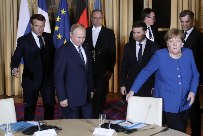 Emmanuel Macron, Vladimir Poutine, Volodymyr Zelensky et Angela Merkel au palais de l’Elysée à Paris, le 9 décembre.