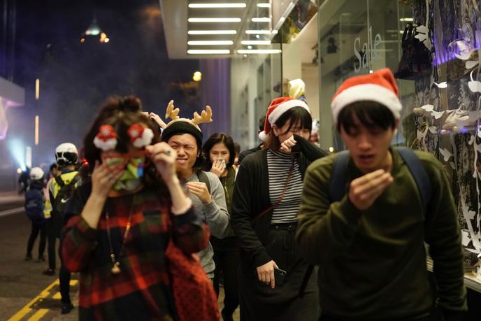 Protesters after a pepper spray attack by police on December 24 in Hong Kong.