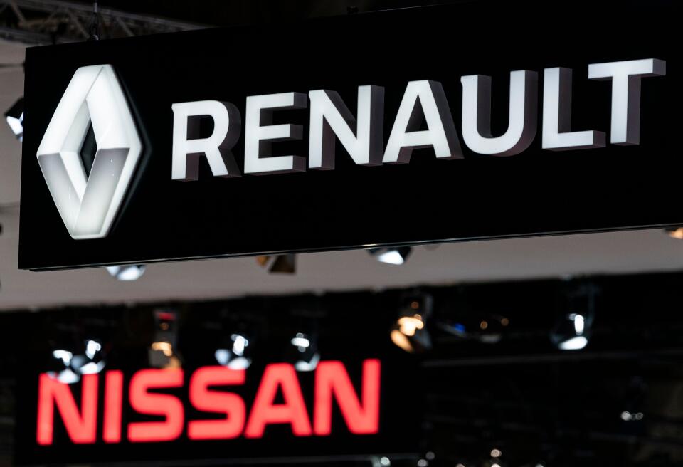 Renault and Nissan autocar logos are pictured during the Brussel Motor Show on January 09, 2020 in Brussel. / AFP / Kenzo TRIBOUILLARD