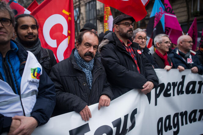 Philippe Martinez (CGT) et Yves Veyrier (FO), le 9 janvier, lors d’une manifestation à Paris.