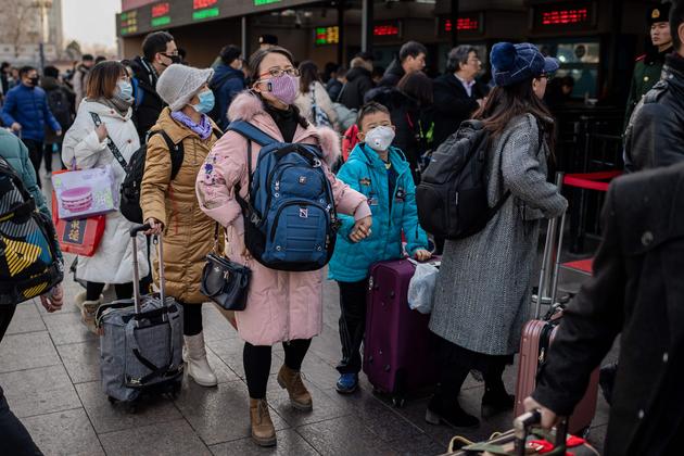 A la gare de Pékin. Les déplacements massifs à l’occasion des célébrations du Nouvel An lunaire présentent un risque de propagation de l’épidémie.