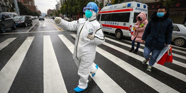 Face au coronavirus, les villes de Chine tentent de se barricader dans une atmosphère de psychose