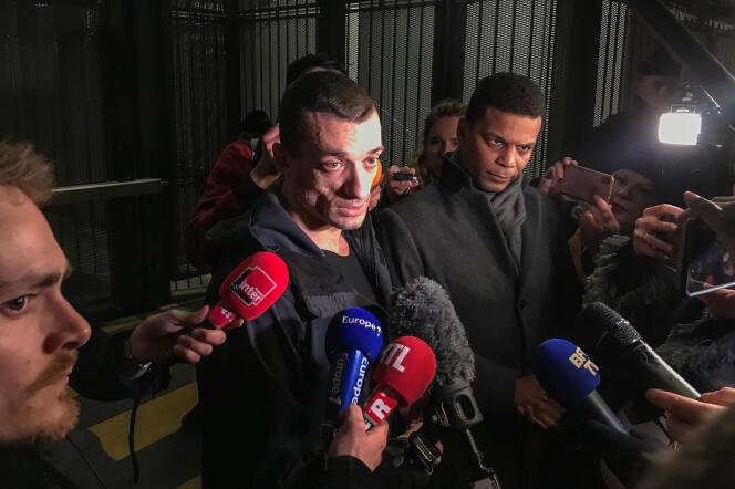 Piotr Pavlenski, accompagné de son avocat Yassine Bouzrou, à sa sortie du tribunal judiciaire de Paris après sa mise en examen, le 18 février.