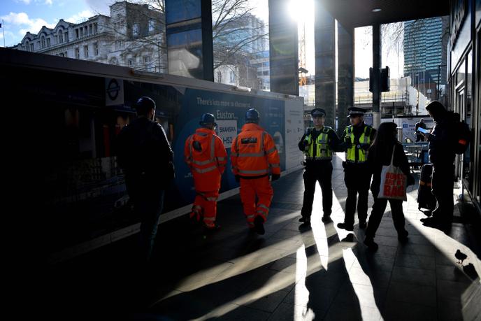 UK tightens migration policy after Brexit 2 Construction workers on a railway site in London, February 11.