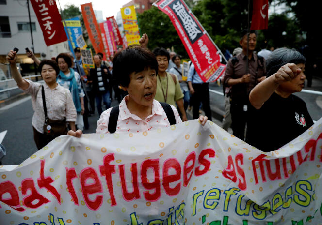 Des manifestants lors d’une marche pour la Journée mondiale des réfugiés, à Tokyo, le 20 juin 2019.