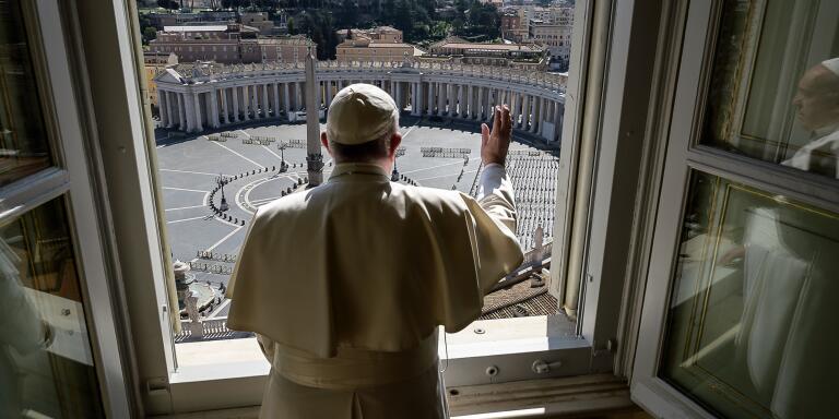 TOPSHOT - This handout picture released by the Vatican Media shows Pope Francis blessing over an empty St. Peter square at the Vatican, after his streamed Angelus prayer, on March 15, 2020. The Vatican said on March 15, that its traditional Easter week celebrations would be held this year without worshippers due to the coronavirus. 