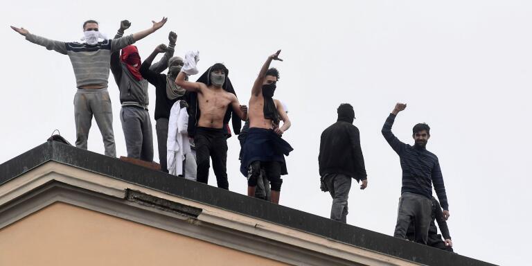 Inmates are seen on the roof of the San Vittore Prison during a revolt after family visits were suspended due to fears over coronavirus contagion, in Milan, Italy March 9, 2020. REUTERS/Flavio Lo Scalzo     TPX IMAGES OF THE DAY