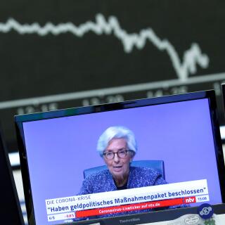 FILE PHOTO: A television broadcast showing Christine Lagarde, President of the European Central Bank (ECB), is pictured during a trading session at Frankfurt's stock exchange in Frankfurt, Germany, March 12, 2020.    REUTERS/Ralph Orlowski/File Photo
