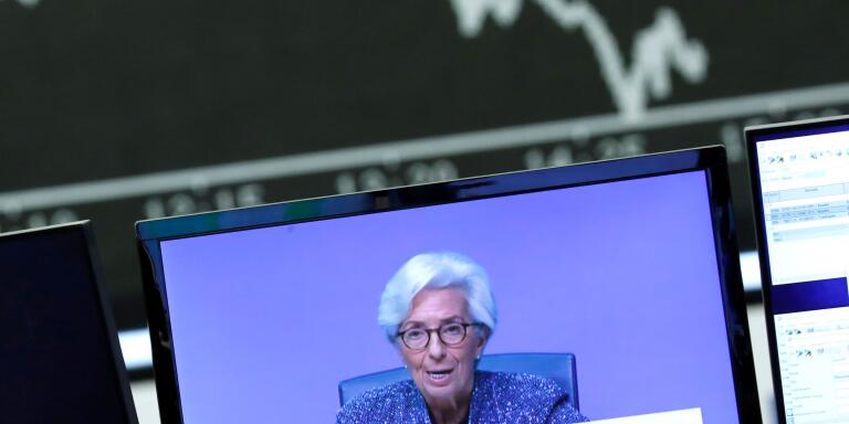 FILE PHOTO: A television broadcast showing Christine Lagarde, President of the European Central Bank (ECB), is pictured during a trading session at Frankfurt's stock exchange in Frankfurt, Germany, March 12, 2020.    REUTERS/Ralph Orlowski/File Photo