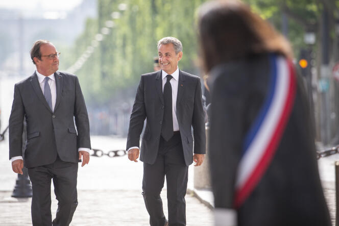 François Hollande et Nicolas Sarkozy participent à la cérémonie de commémoration de la victoire de 1945 à Paris, le 8 mai.