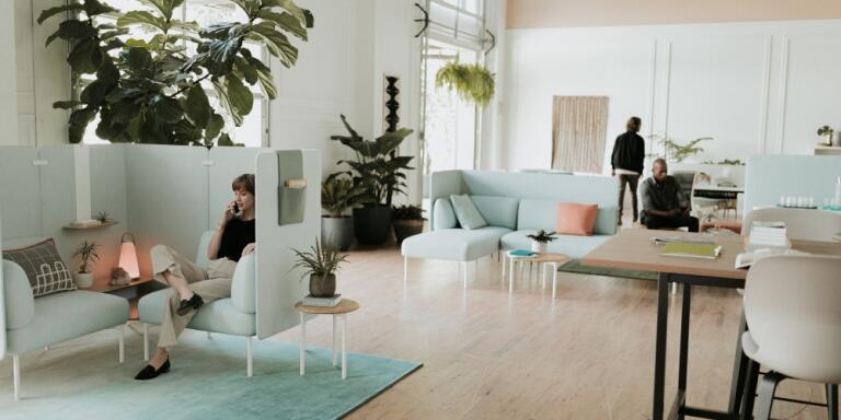 Two single seat sofas with two-tier table and high screens. Shown with UMA light, GAN rug and Openest Sprig tables. Also shown is a Cultivate table with Maari stools.