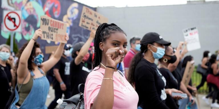 A woman takes part in a protest against the death in Minneapolis police custody of George Floyd, in New Rochelle, New York, U.S., June 3, 2020. Picture taken June 3, 2020.  REUTERS/Joy Malone