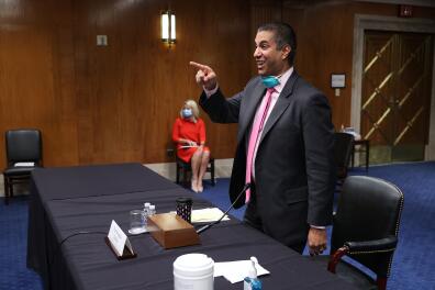 FCC Chairman Ajit Pai says goodbye to members of a Senate Appropriations Subcommittee afters testifying during a hearing on Capitol Hill June 16, 2020 in Washington, DC. The hearings focus is on oversight of the Federal Communications Commission spectrum auctions program for fiscal year 2021. / Getty Images / POOL / Chip Somodevilla 